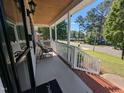 Inviting covered front porch offers a relaxing outdoor seating area at 908 E Hudson Ave, Durham, NC 27704