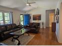 Cozy living room featuring hardwood floors, comfortable seating, and ample natural light at 908 E Hudson Ave, Durham, NC 27704
