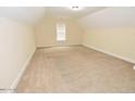 Spacious bedroom with neutral paint, carpet, and a window for natural light at 1126 Falling River Walk, Rocky Mount, NC 27804