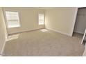 Comfortable bedroom with carpet, natural light from windows, and closet space at 1126 Falling River Walk, Rocky Mount, NC 27804
