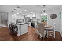 Bright kitchen showcases an island, stainless steel appliances, and an adjacent breakfast nook with natural light at 1205 Willow Dr, Chapel Hill, NC 27517