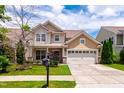 Traditional home with a well-maintained lawn, two-car garage, and inviting curb appeal at 1320 Cozy Oak Ave, Cary, NC 27519