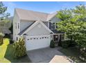 Charming two-story home with a two car garage and mature landscaping at 2037 Summer Shire Way, Raleigh, NC 27604