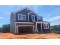 Charming two-story home with a two-car garage, blue siding and white trim, exuding modern elegance at 216 Sprenger St, Garner, NC 27529