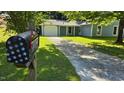 Street view of a home with a well-manicured lawn and driveway, captured from the mailbox at 2725 Westchester Dr, Burlington, NC 27217