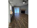 Open-concept living room featuring modern flooring, a cozy fireplace, and sliding glass doors at 2725 Westchester Dr, Burlington, NC 27217