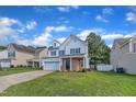 Attractive two-story home with a well-manicured lawn and a welcoming facade at 3119 Guiding Light Rd, Raleigh, NC 27610