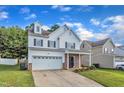 Beautiful two-story home with a two-car garage and manicured lawn at 3119 Guiding Light Rd, Raleigh, NC 27610