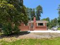 Charming single-story brick house with white trim, steps to the front door, and a well-maintained lawn at 3323 Baugh St, Raleigh, NC 27604