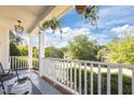 Spacious front porch with seating, offering a relaxing outdoor space with a neighborhood view at 513 Moultonboro Ave, Wake Forest, NC 27587
