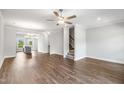 Spacious living room with hardwood floors and open layout to dining and kitchen at 555 Forestville Rd, Wake Forest, NC 27587