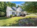 Well-maintained home with lush landscaping and a welcoming front entrance at 82 Finley Ct, Clayton, NC 27520