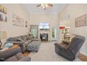 Cozy living room with high ceilings, fireplace, and comfortable seating at 82 Finley Ct, Clayton, NC 27520