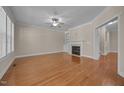 Cozy living room with a fireplace and abundant natural light, perfect for relaxation and gatherings at 1012 Palace Garden Way, Raleigh, NC 27603