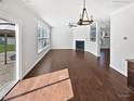 Spacious living room with hardwood floors, a fireplace, and a ceiling fan at 1092 Adams Point Dr, Garner, NC 27529