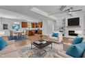 Open-concept living space showcases the seamless flow between living room, kitchen, and dining, perfect for modern living at 125 Davis St, Louisburg, NC 27549