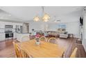 Open concept view of the dining room and Gathering room with hardwood flooring at 174 Arrow Ln, Middlesex, NC 27557