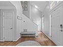 Stylish foyer with hardwood floors, shiplap accent wall, and ample natural light welcomes you home at 208 Silk Hope Dr, Cary, NC 27519