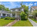 Charming two-story home featuring a welcoming front porch and landscaped yard at 218 Villa St, Rocky Mount, NC 27804