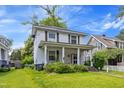 Charming two-story home featuring a welcoming front porch with classic columns at 218 Villa St, Rocky Mount, NC 27804