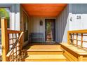 Inviting front porch with a cozy bench, offering a warm welcome to the home at 28 Benchmark, Pittsboro, NC 27312