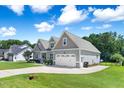 Beautiful home showcases a two-car garage and well-maintained lawn at 308 Nashville Dr, Archer Lodge, NC 27527