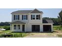 Charming two-story home with attached two-car garage, in a rural setting at 3895 Josiah Ct, Nashville, NC 27856