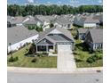 This home boasts a manicured lawn, inviting curb appeal, and a desirable neighborhood setting at 405 Bramble Ln, Clayton, NC 27527