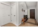 Bright foyer with hardwood floors and a decorative front door at 6205 Houndsman Ct, Raleigh, NC 27616