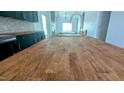Butcher block countertop and deep basin sink on a spacious kitchen island, with modern faucet at 109 N Dunn St, Angier, NC 27501