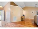 Spacious living room with beautiful hardwood floors, neutral walls and plenty of natural light at 1401 Burchcrest Dr, Garner, NC 27529