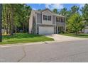 Charming two-story home featuring a two-car garage, stone accents, and well-maintained landscaping at 170 Lothian, Rocky Mount, NC 27804