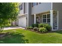 Charming home featuring stone accents, well-maintained landscaping, and a side-entry garage at 170 Lothian, Rocky Mount, NC 27804