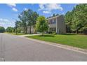 View of the side exterior of a charming home with well-maintained landscaping and a lush green lawn at 170 Lothian, Rocky Mount, NC 27804