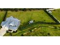 Expansive backyard with lush greenery, garden, shed, and privacy trees at 192 Waterpine Dr, Garner, NC 27529