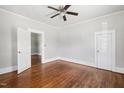 Spacious bedroom with a ceiling fan, hardwood floors, and neutral paint at 2927 S Church St, Rocky Mount, NC 27803