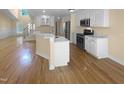 Open concept kitchen with stainless steel appliances and a kitchen island at 495 Ruth Cir, Fuquay Varina, NC 27526