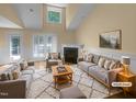 Bright and airy living room featuring a fireplace and neutral-toned furniture at 495 Ruth Cir, Fuquay Varina, NC 27526