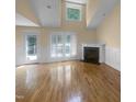 Open living area with hardwood floors, fireplace, and natural light at 495 Ruth Cir, Fuquay Varina, NC 27526