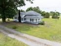 Two-story farmhouse with inviting front porch and large front yard at 5004 Us 70 Alt, Princeton, NC 27569