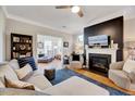 Comfortable living room with a fireplace, hardwood floors, and stylish furniture at 1004 Sounding Ln, Durham, NC 27703