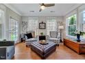 Inviting living room with hardwood floors, a ceiling fan, and plenty of natural light at 1004 Sounding Ln, Durham, NC 27703