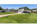Lovely one-story brick home with a large, green front yard and convenient carport parking in the back at 117 James Dr, Pine Level, NC 27568