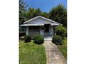 Attractive single-story home with a welcoming front porch and meticulously kept lawn, inviting you to make it your home at 1305 E Jones St, Raleigh, NC 27610