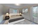Inviting bedroom features neutral décor, plush carpeting, and bright natural light at 133 N Chubb Rdg, Wilson's Mills, NC 27520