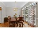 Elegant dining room with decorative table and chairs and lots of natural light at 208 Holly Green Ln, Holly Springs, NC 27540