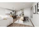 Open-concept living space with modern kitchen, dining area, and cozy living room at 3017 White Rail Dr, Fuquay Varina, NC 27526