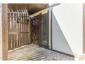 A private entryway with a secure wooden gate and a well-lit front door, providing a welcoming entrance at 4305 Lake Ridge Dr, Raleigh, NC 27604