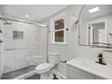 Modern bathroom featuring marble-tiled shower, sleek vanity, and stylish lighting for a luxurious feel at 606 E Club Blvd, Durham, NC 27704