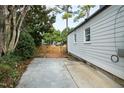 Simple backyard featuring a concrete patio and a privacy fence, perfect for outdoor activities at 625 New Road Rd, Raleigh, NC 27608